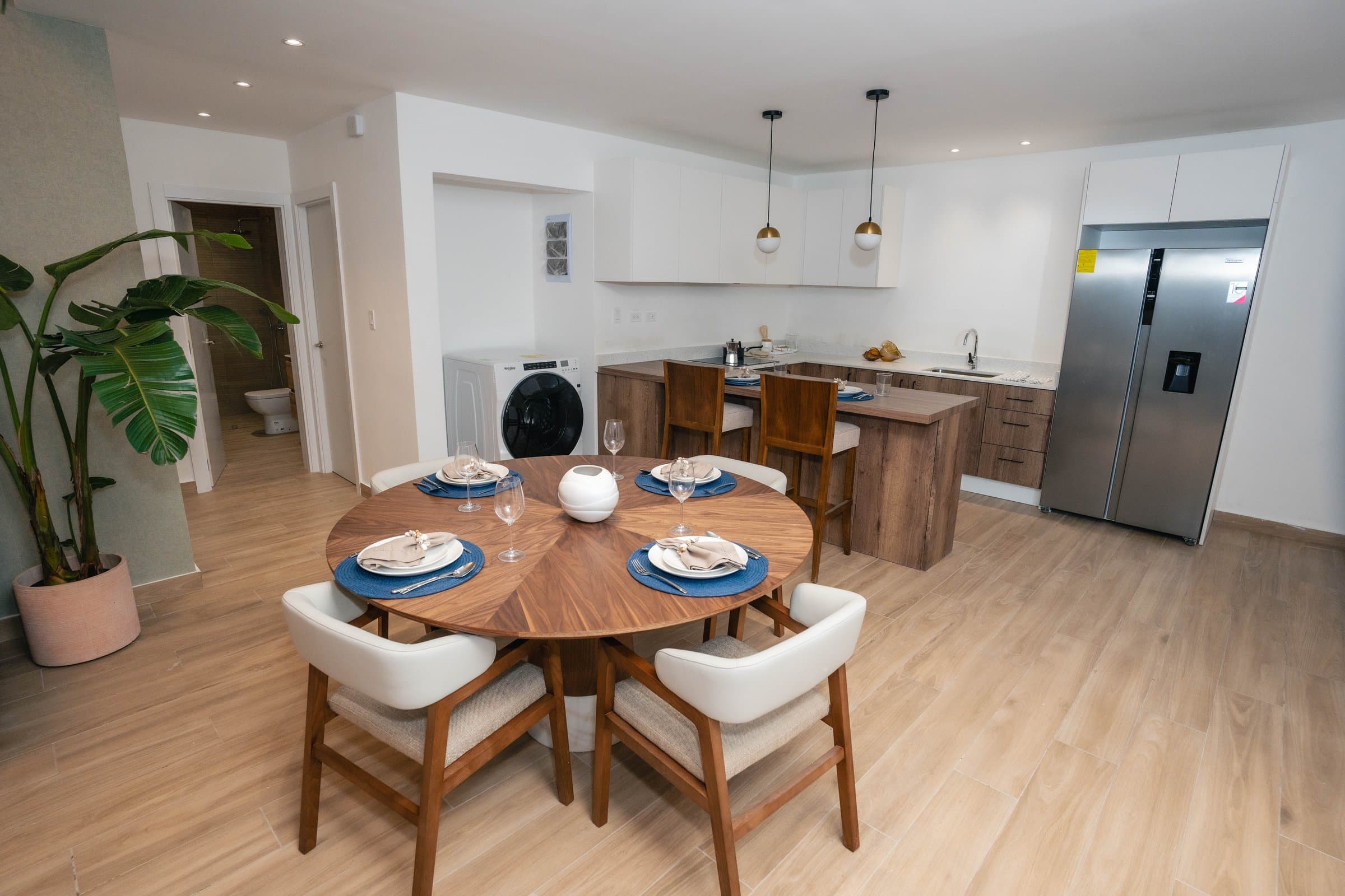 Kitchen opening to a dining table