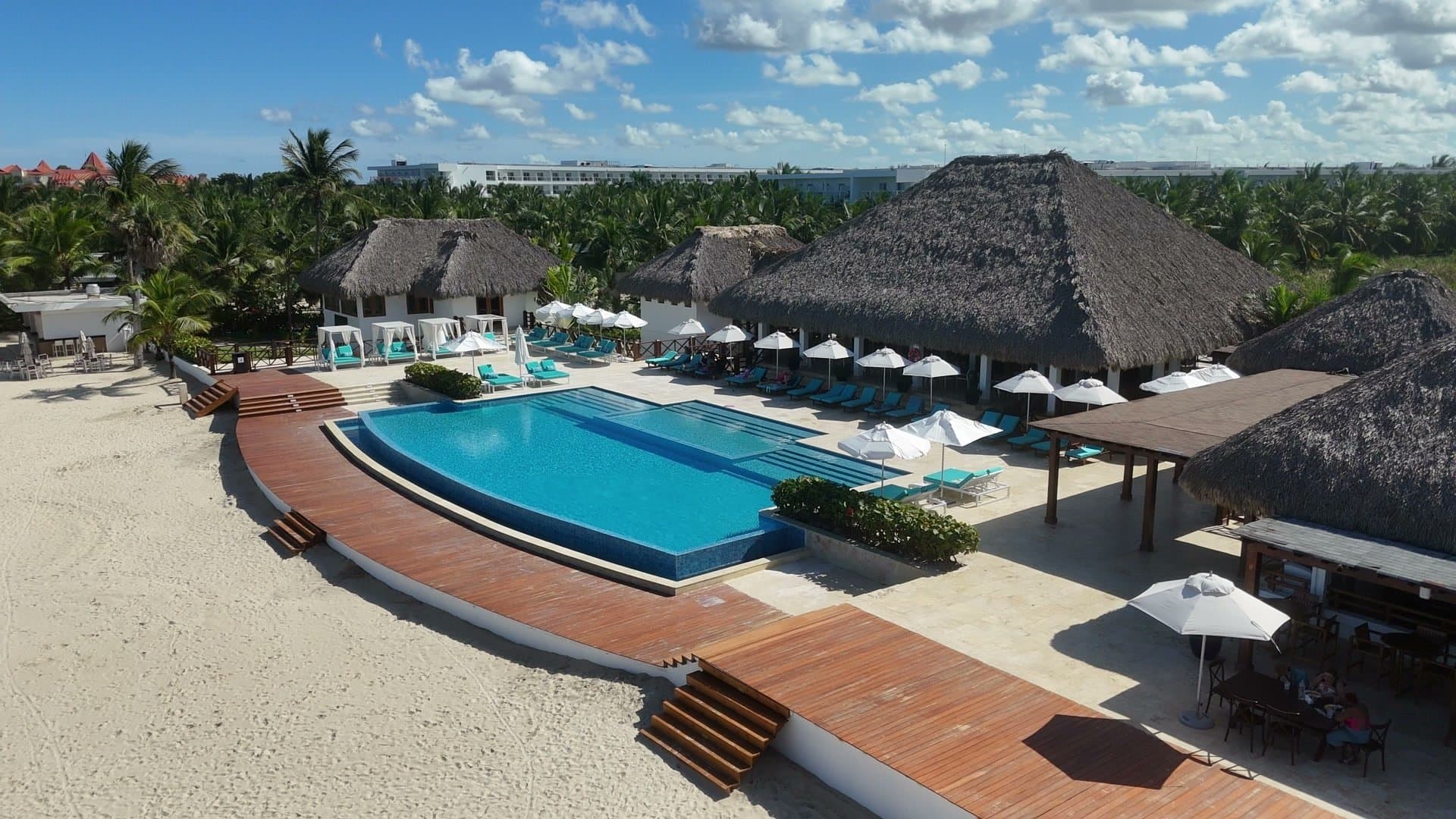 Cana Bay beach club infinity pool beside the ocean
